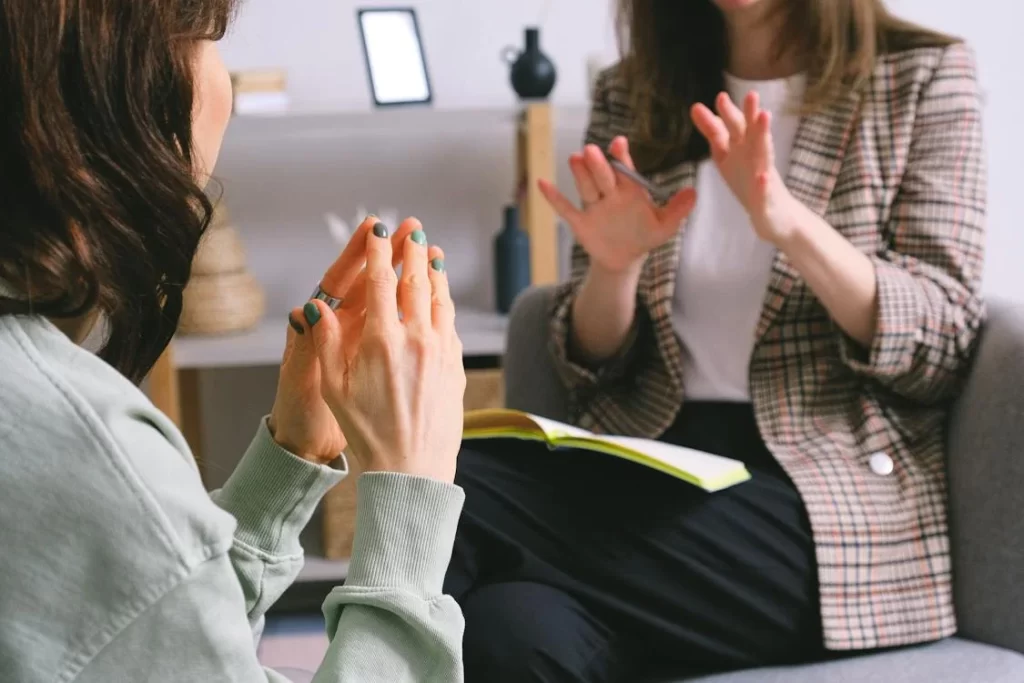 female-psychologist-and-patient-discussing-mental-problems-during-session