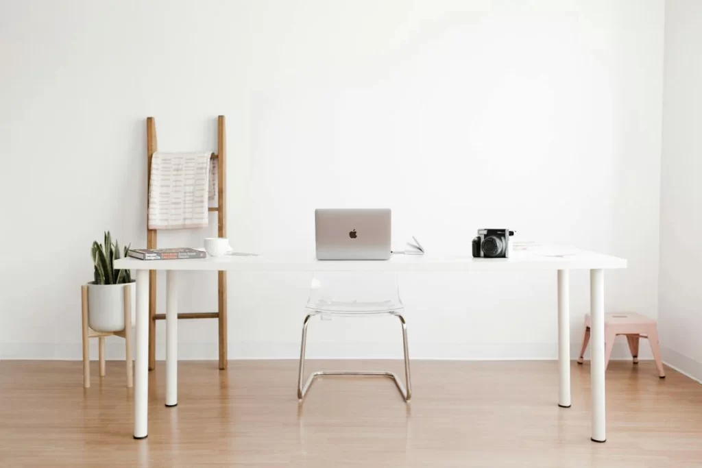 silver-macbook-on-white-table